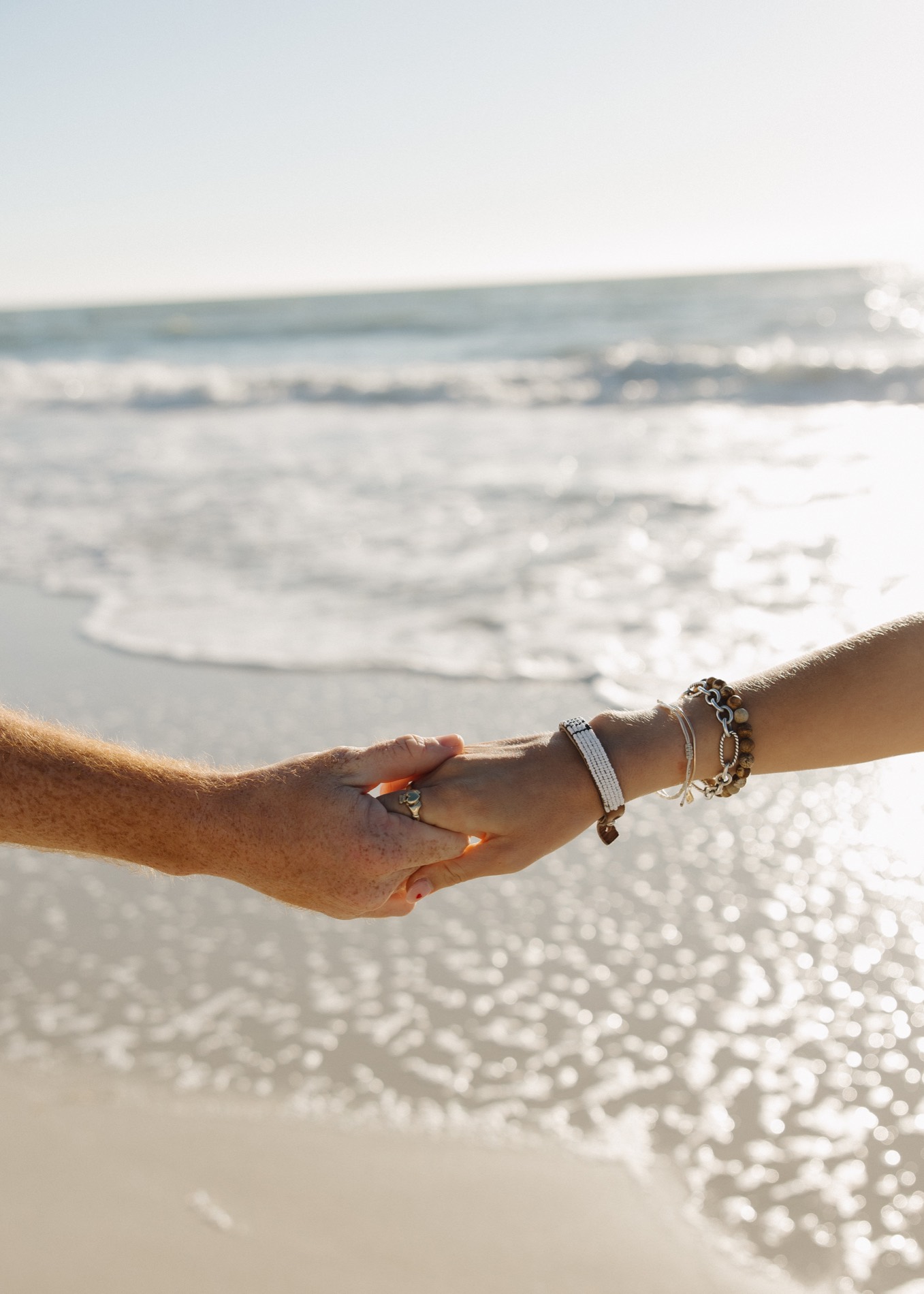 Jacquelyn and Ryan together by the beach